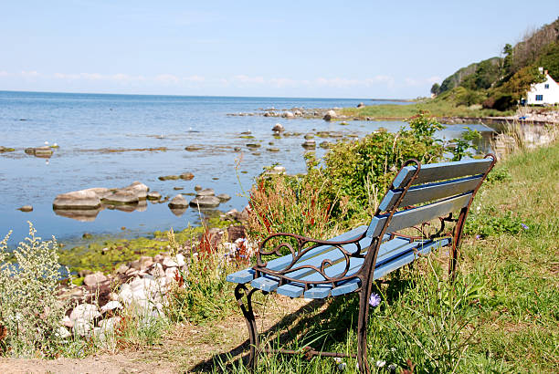 Seating bench "Seating bench at the seaside - Western coast of Bornholm, Denmark" stone bench top view stock pictures, royalty-free photos & images