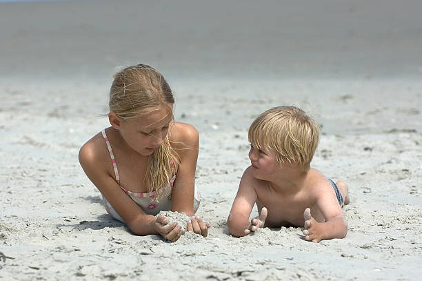 istock Two children playing at the beach 174703701