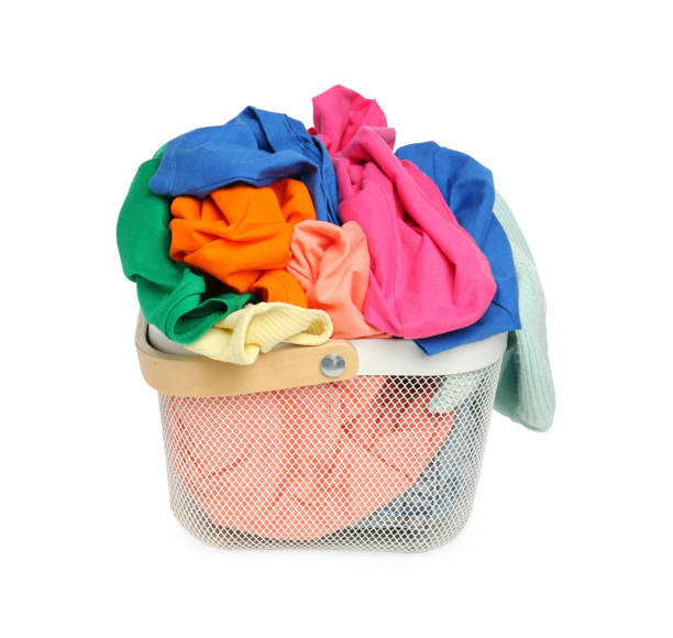 istock Laundry basket with clean colorful clothes isolated on white 1747050448