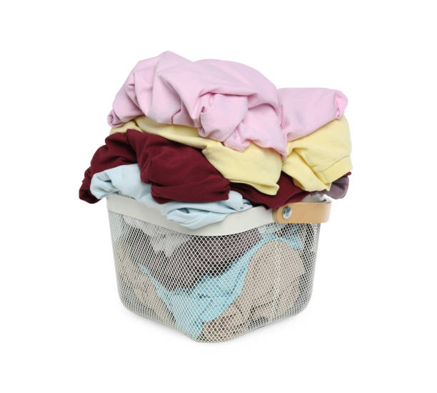 istock Laundry basket with clean colorful clothes isolated on white 1747051054