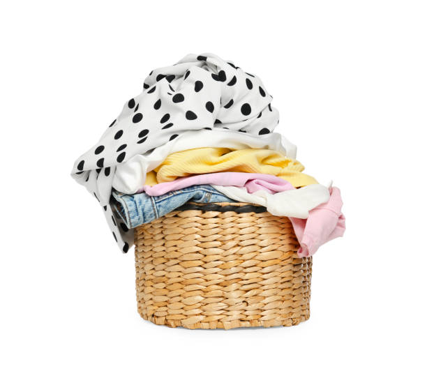 istock Wicker laundry basket with clean colorful clothes isolated on white 1747051570