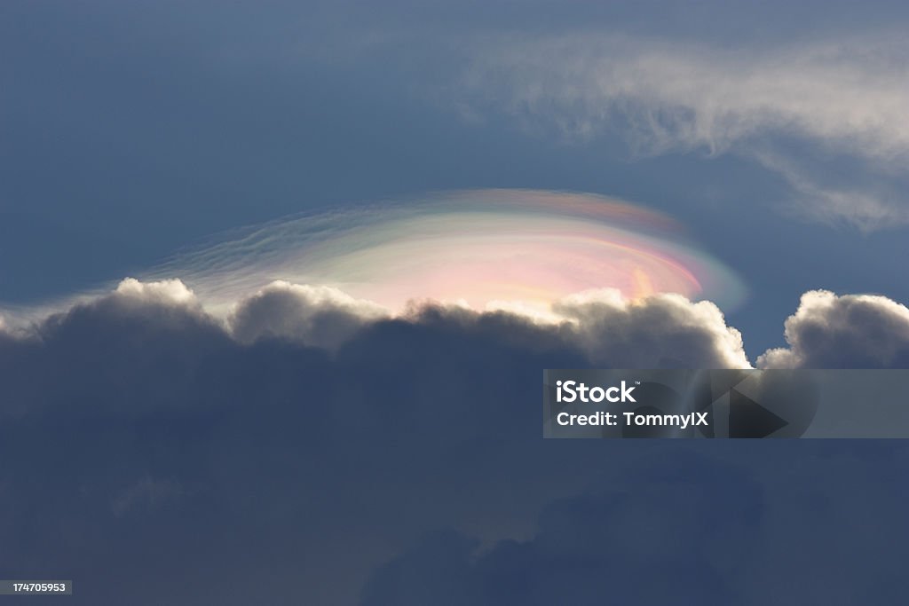 Nacreous clouds "Nacreous clouds (iridescent clouds, Mother-of-Pearls clouds, rainbow clouds) The beautiful natural phenomenon." Backgrounds Stock Photo