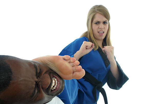 detener una attacker - sole of foot martial arts karate female fotografías e imágenes de stock