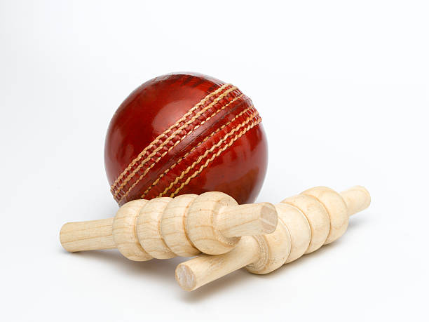 istock Cricket ball and bales isolated on a white background 174706099