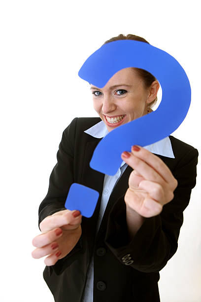 istock Business woman peeking through a question mark 174706117