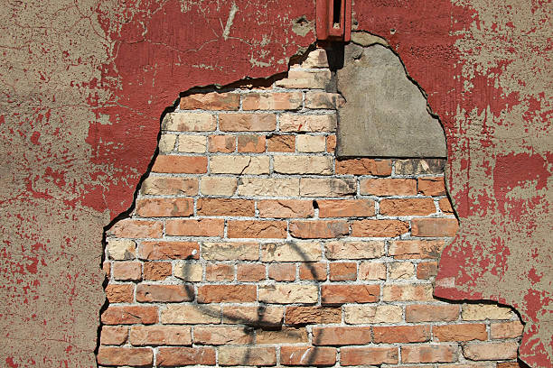 istock Decaying Red Plaster Reveals Grunge Brick and Cement 174706209