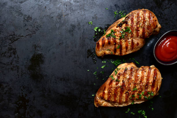 istock Grilled checken breast. Top view with copy space. 1747079148