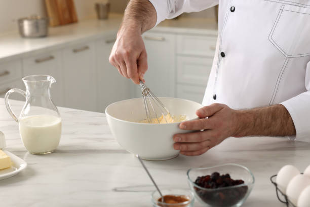 istock Professional chef making dough at white marble table indoors, closeup 1747092172