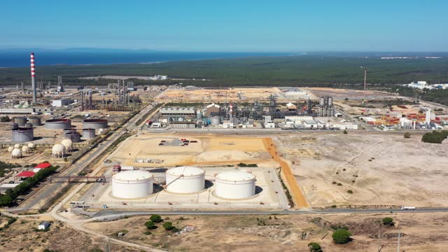 Oil terminal storage tanks, aerial view, oil and gas storage tanks, oil refinery chemical products. Moving to the side. Portugal Sines