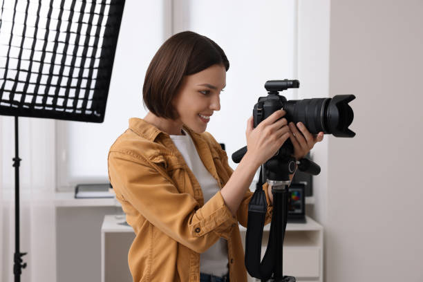 istock Professional photographer working with camera in modern photo studio 1747108748