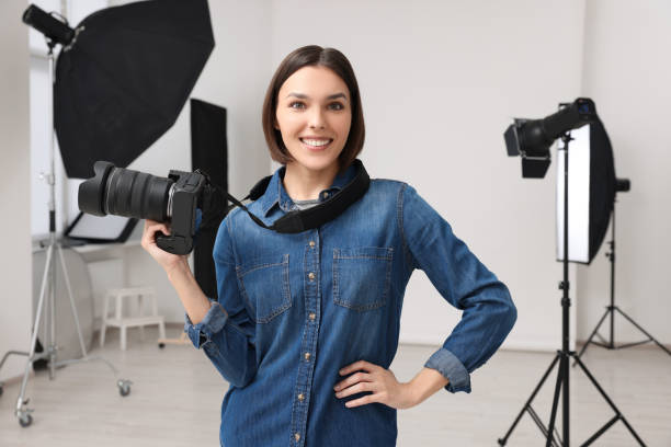 istock Professional photographer with camera in modern photo studio 1747109791
