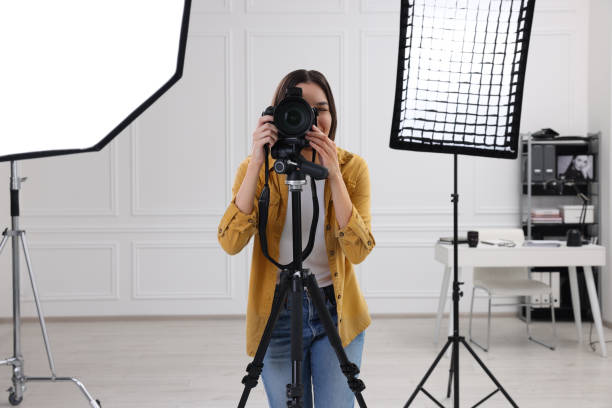 istock Professional photographer taking picture in modern photo studio 1747110377