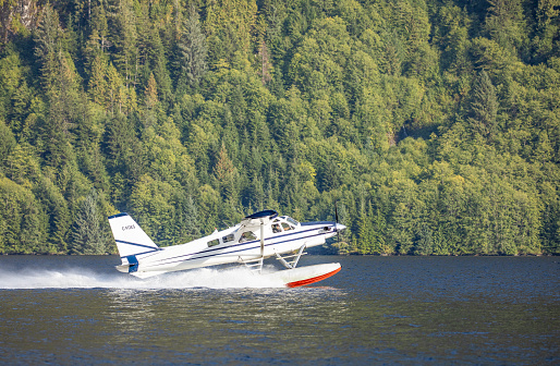 A de Havilland Canada DHC-2 Beaver Air Cab, owned by C.B.E. Construction Ltd, taking off from Smith Inlet in Great Bear Rainforest, British Columbia, Canada. The CHC-2 Beaver is a short takeoff and landing (STOL) amphibious floatplane mostly used as a bush plane.