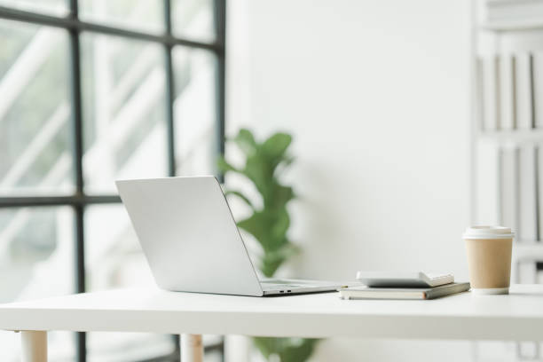 istock Office desk workspace, nobody, no people, minimalist design, empty workstations ready to fuel creativity. Ideal for todayâs professionals. Dive into productivity in style. 1747283675