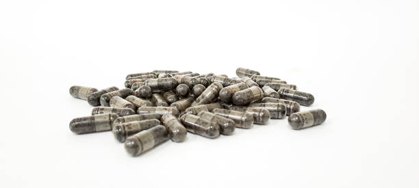 istock Black cumin capsules or commonly called (Habbatussauda) are isolated on a black background. Nigella sativa 1747288842