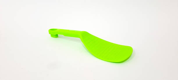 istock Green Plastic Rice Paddle Spoon isolated on white background. 1747288856