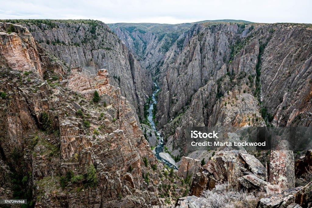 Steep Cliffs in Black Canyon of the Gunnison. Hard to capture just how steep the cliffs are in this National Park. At The Edge Of Stock Photo