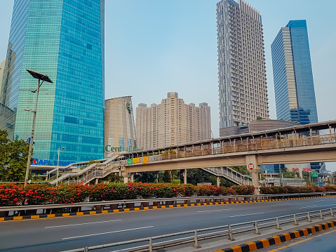 Jakarta, Indonesia - October 14, 2023: view of a pedestrian bridge with office buildings and shopping centers in Jakarta in the background.
