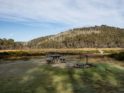 Picnic tables and chairs next to Lake Catani in Mount Buffalo National Park