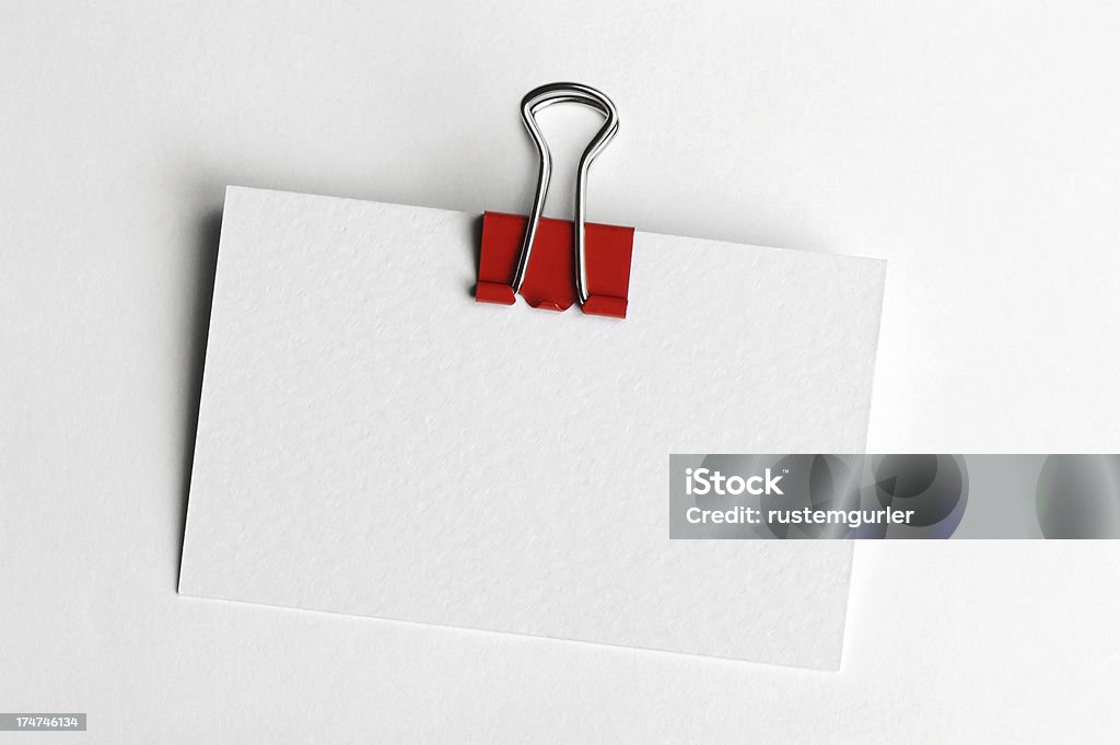 Blank business card with paperclip Blank business card with paperclipisolated on a white background. Objects with Clipping Paths Index Card Stock Photo