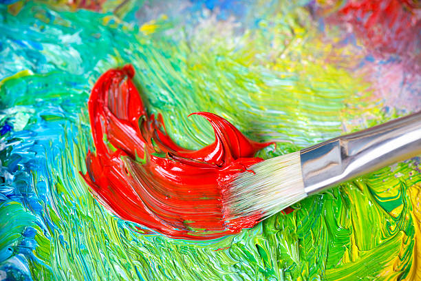 istock Paintbrush with oil paint on a classical palette 174746204