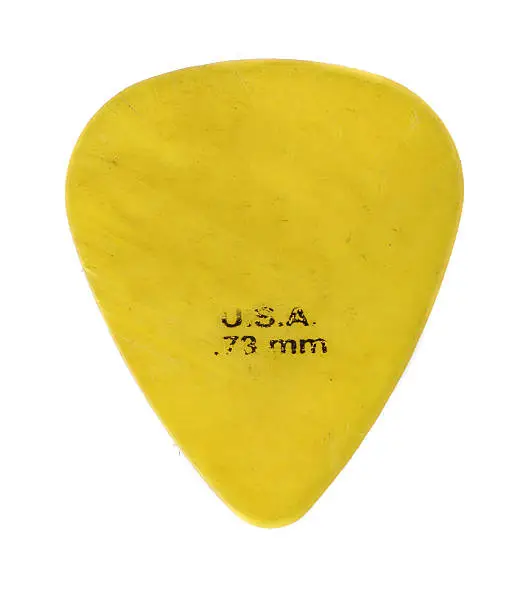 Yellow worn and used Guitar pic .73mm