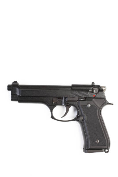 istock Closeup of a pistol isolated on white background 174746876
