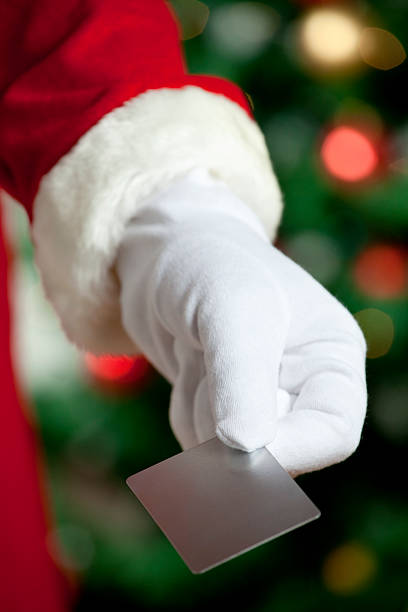 istock Santa Claus giving a blank gift card 174748303