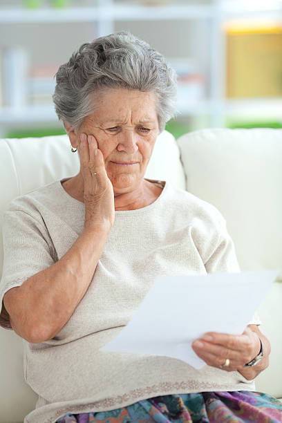istock Senior woman with some document at home. 174748375