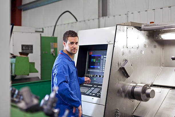 istock Industry worker in front of a turning machine 174748440
