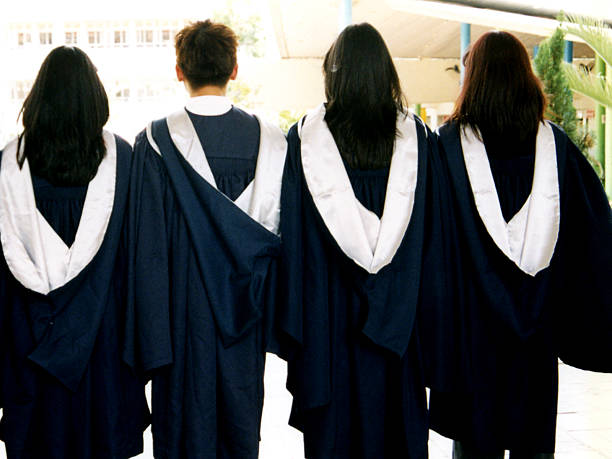 Graduates Back of graduates. high school student classroom education student stock pictures, royalty-free photos & images