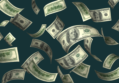 Lots of hundred dollar bills falling - High detail image on dark green background.