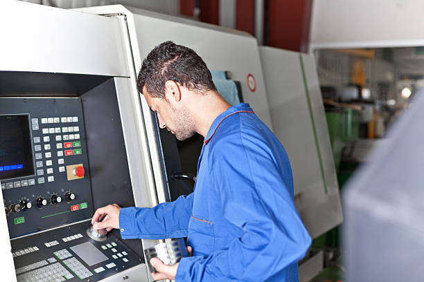 istock Industry worker in front of a turning machine 174749325