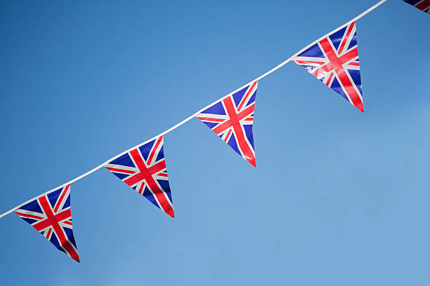 istock Union Jack Bunting and blue sky 174749337