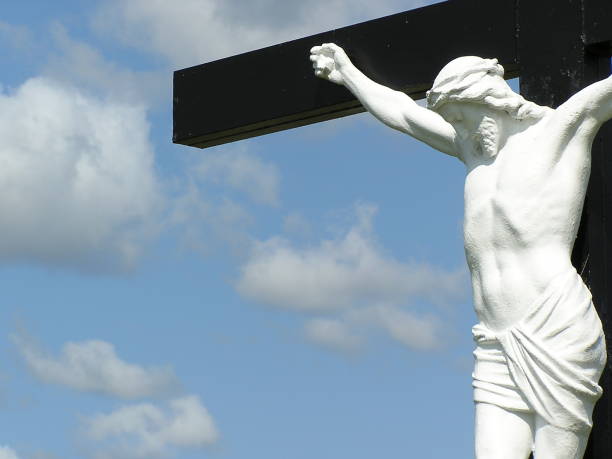 istock Christ on the Cross Under Cloudy Skies 174749483