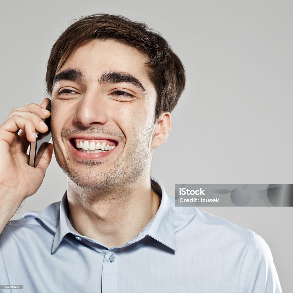 Happy businessman on phone Close up of happy businessman talking on mobile phone. 25-29 Years Stock Photo