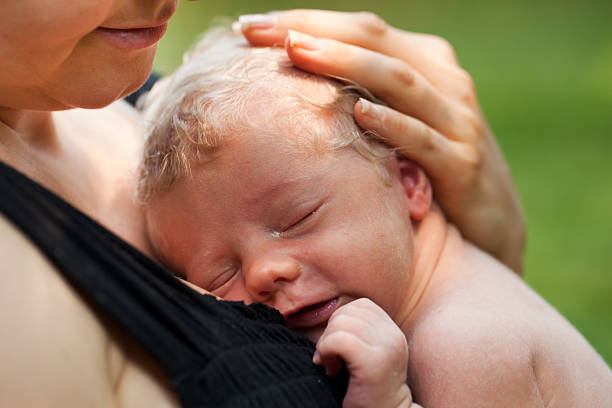 istock Mom holding newborn baby boy 174749861