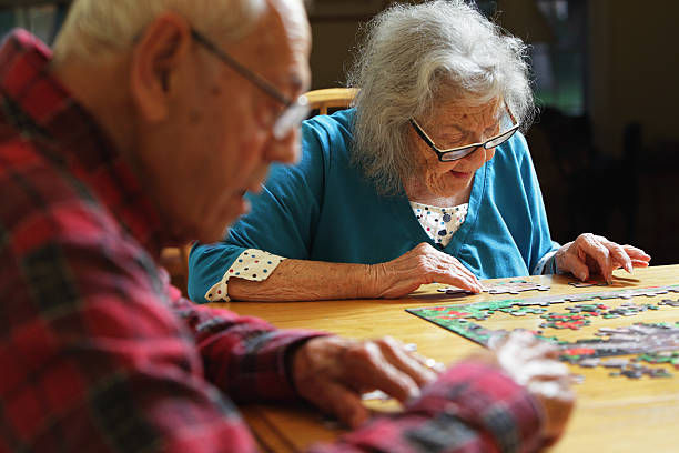 istock Senior Couple Working Jigsaw Puzzle 174749947