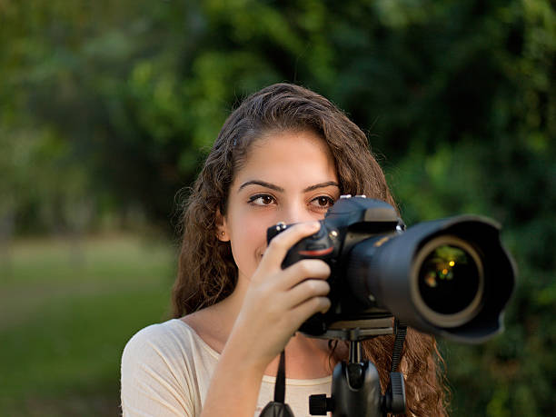 istock Young beautiful girl taking pictures 174750030