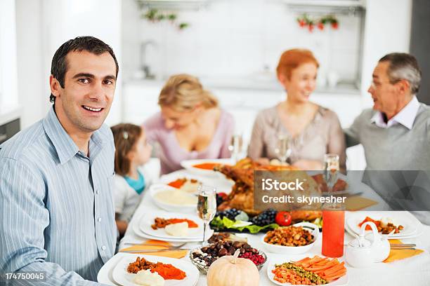 Large Family At The Dinner Table For Thanksgiving Day Stock Photo - Download Image Now