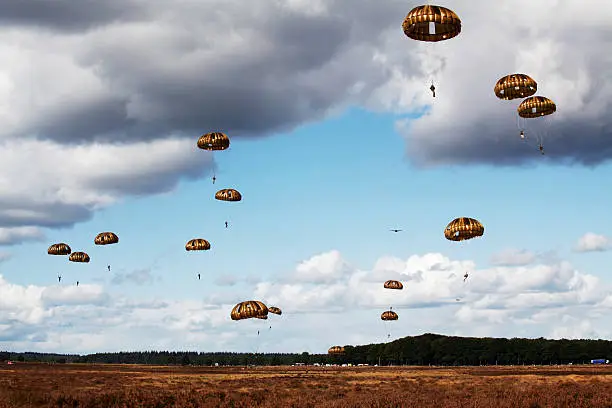 "Remembering of the world war ll Operation Market Garden the largest airborne landing operation ever was a failure that cost thousands of lives. More than 12,000 men, (Britiish, American and Poles) were dropped near Ede, but only 2,200 made it back home. The depiciitng parachutists are some of the thousand soldiers dropped during the Remembering at 22 september 2012. The remembering is a yearly event in Ede, Netherlands."