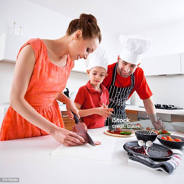 Happy Family Cooking Pizza Stock Photo - Download Image Now - 25-29 Years, 30-34 Years, Adult