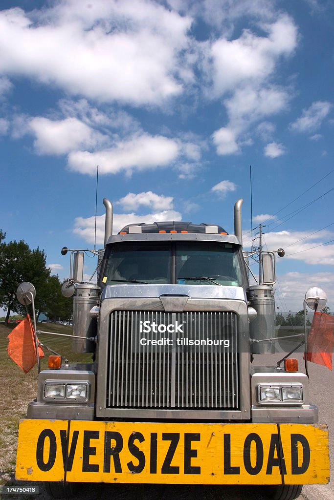 Big Truck Oversized Load Transport truck with oversized load sign . Loading Stock Photo