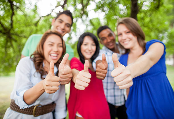 istock Cheerful friends making thumbs up 174750592
