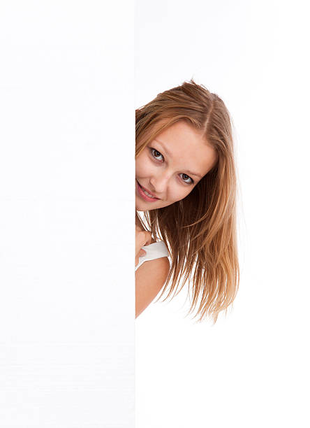 istock Cute young women behind a blank banner ad 174750593