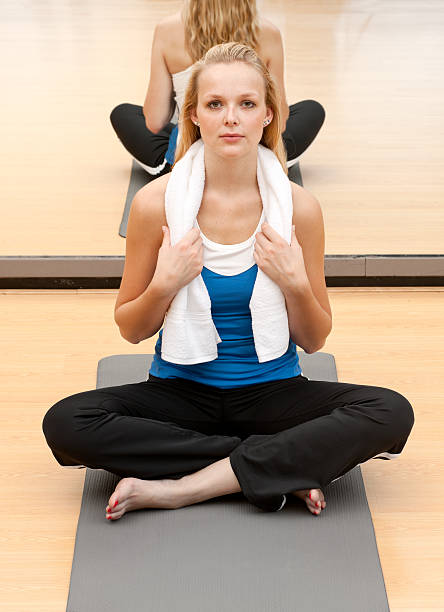 young woman relaxing in gym