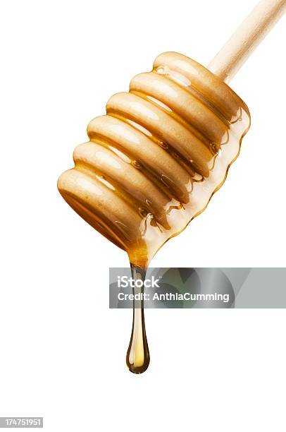 Pure Golden Manuka Honey Pouring From A Wooden Drizzler Stock Photo - Download Image Now
