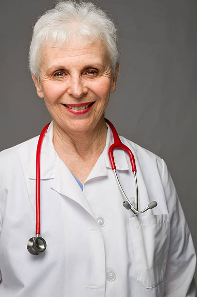 Smiling Olde Doctor Female stock photo