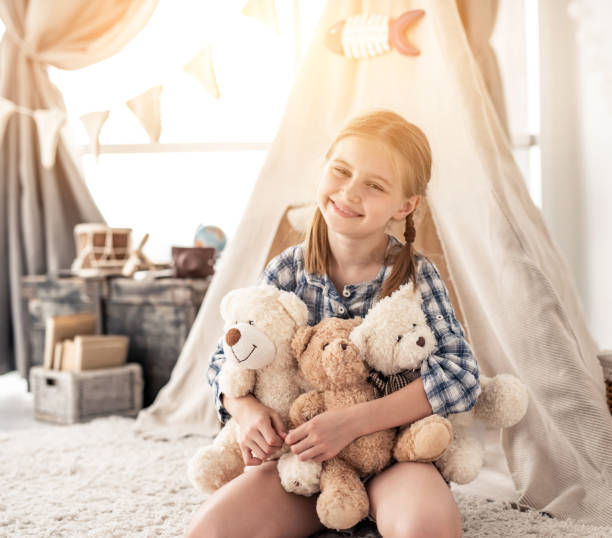 istock Little girl holding teddy bears 1747522270