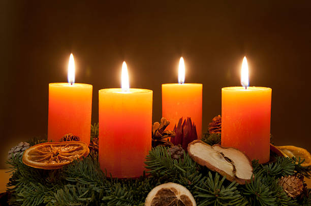 Advent wreath with candles lit Advent wreath advent candle wreath adventskranz stock pictures, royalty-free photos & images